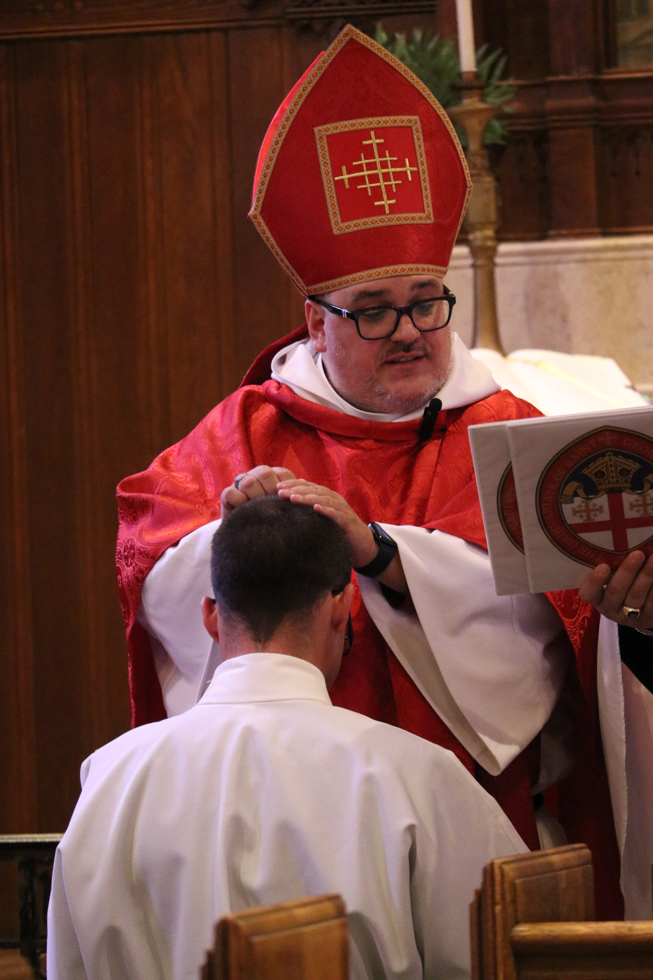 Bishop Whetstone laying hands on Deacon John Kalajian during his ordination to the diaconate