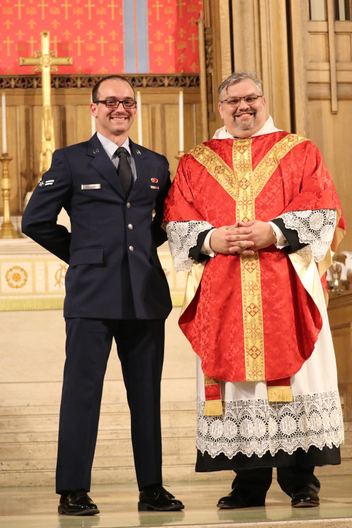 Fr. Liam with his husband following the ordination service.